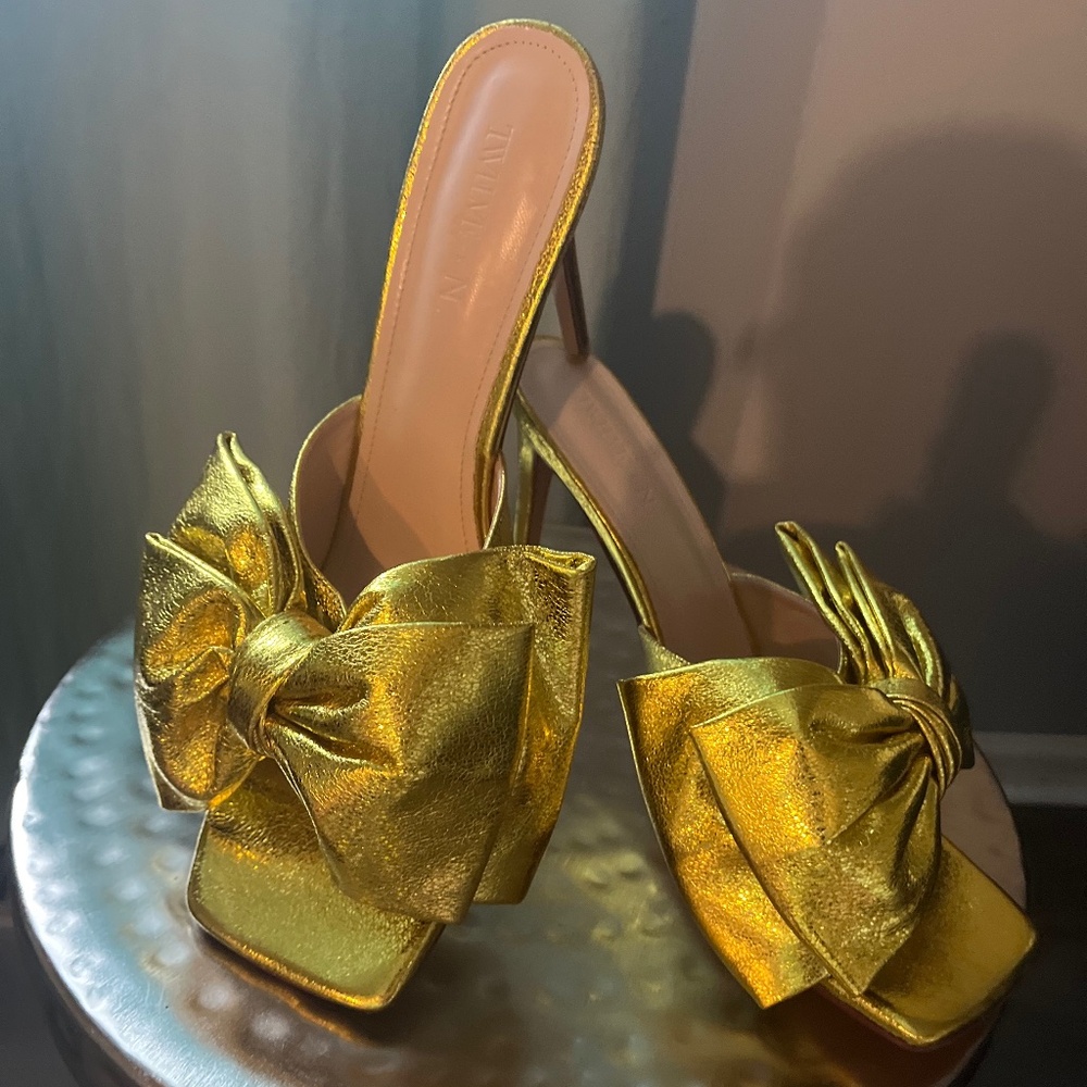 Gold heels by Eleven thirty